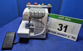 A JANOME 9300DX 4-Thread Overlocking Machine with Treadle Operation