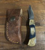 Custom Damascus Steel Folding Knife with Embossed Leather Sheath