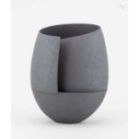 † ASHRAF HANNA (born 1967); a cut and altered earthenware vessel with textured black surface,