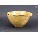† LUCIE RIE (1902-1995) & HANS COPER (1920-1981); a large stoneware salad bowl covered in mustard