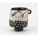 † JOHN MALTBY (1936-2020); a stoneware cup form decorated with a lattice pattern and stylised