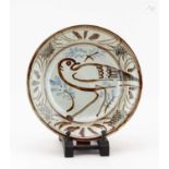 † SETH CARDEW (1934-2016) for Wenford Bridge Pottery; a stoneware plate decorated with a bird,