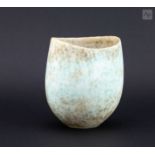 † JOHN WARD (1938-2023); a small oval stoneware vessel covered in mottled cream and turquoise