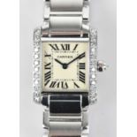 CARTIER; a lady's Tank Francaişe diamond set wristwatch, the dial set with Roman numerals flanked by