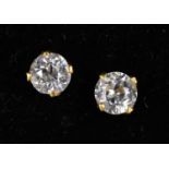 A pair of diamond set ear studs in yellow metal unmarked frames, test as 18kt gold on Thermo