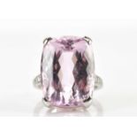 BOODLES; a platinum kunzite and diamond dress ring, the oval faceted cut kunzite measuring approx