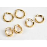 A pair of 18ct yellow gold hoop earrings, combined approx 3.97g, and two pairs of 14ct gold hoop
