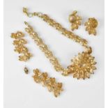 CHRISTIAN DIOR; a c1960 gold tone and champagne crystal glass necklace with a large floral