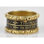 A 19th century yellow metal and enamel mourning ring, inscribed 'Thomas Wace OB 14 March 1823 AE 7