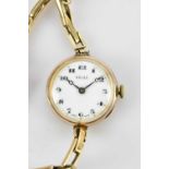 ROLEX; an Art Deco lady's yellow gold watch marked 375 with white enamel dial with black Arabic