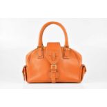 LOEWE; a burnt orange grained leather bowling bag, with contrast stitching, central flap-over