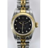 ROLEX; a lady's Oyster Perpetual bimetal wristwatch, the black face set with diamond dot dial,
