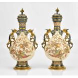 ROYAL WORCESTER; a pair of twin handled lidded vases, decorated with vines and fruit, height 40cm (
