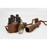 A leather cased four drawer telescope, a leather cased pair of binoculars, and silver plated hip