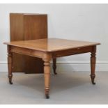 A Victorian mahogany exending dining table with two additional leaves, on turned supports, height