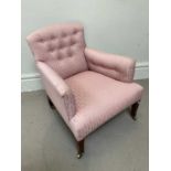A 19th century armchair in the style of Howard & Sons.