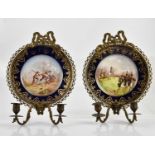 A pair of late 19th/early 20th century French Sevres style porcelain plates hand painted with battle