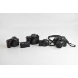 A collection of digital cameras, to include a Nikon D7500, a Nikon D5600 (both for spares or