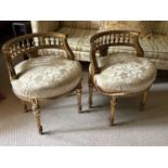A pair of late 19th century French Louis XV style gilt wood and gesso low chairs/stools, upholstered
