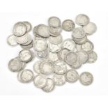 A collection of fifty-five silver shillings, 1919 and prior, including an 1817 example, and two 1826