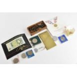 A collection of predominantly British coins including various George III and later pennies,