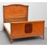 An Edwardian satinwood double bedstead with gilt metal mounts, with rails and base.