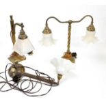 Two brass table lamps, larger 39cm, together with a wall light.