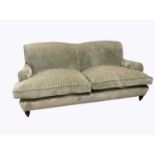 A modern two seater settee, with olive green upholstery, on turned legs, length 192cm. Condition