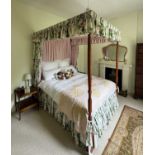 A modern pine four poster bed, with turned and block legs, height 220cm, length 210cm. Provenance: