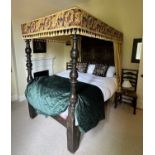 A 17th century and later oak four poster tester bed, with panelled canopy and back, the back with