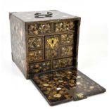 A late 19th century Japanese mother of pearl inlaid lacquered jewellery box, the pull-down front