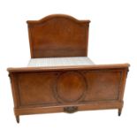 A Louis XVI style French oak and gilt brass mounted double bed, with arched headboard, height 161cm,