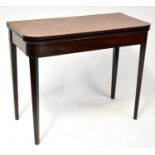A George III mahogany fold-over tea table, on square tapering legs, 75 x 91 x 44cm.