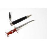 PUMA, SOLINGEN; a post-war Third Reich SA dagger, the 22cm double-edged blade inscribed 'Alles Für