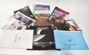 A collection of various Citroën car brochures.