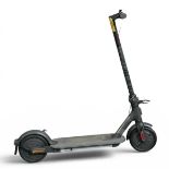 XIAOMI; a modern folding electric scooter, with charger.