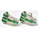 A pair of 18ct white gold stud earrings set with emeralds and diamonds, combined approx. 4.8g.
