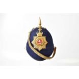 A Victorian era King's Liverpool Regiment helmet, with helmet spike, regimental badge and chain (