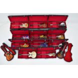 THE BEATLES; a collection of thirteen miniature 1:4 scale guitars used by The Beatles, including