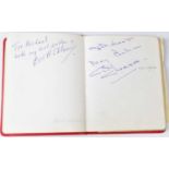 A vintage red autograph book containing a large quantity of autographs, to include Paul McCartney of