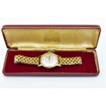 GARRARD; a gentleman's 9ct gold automatic wristwatch, the silvered dial set with baton markers,