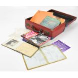 An autograph book with a collection of signatures from artists such as Adam Faith, Dusty