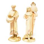 ROYAL WORCESTER; a pair of James Hadley porcelain figures of water carriers, the gentleman and