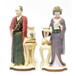 ROYAL WORCESTER; a pair of James Hadley porcelain figures of a Japanese gentleman and lady, each