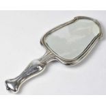 WILLIAM NEALE & SONS; an Edward VII hallmarked silver Art Nouveau hand mirror, the back repoussé