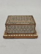 A VINTAGE HANDMADE CIGARETTE DISPENSER WITH MOTHER OF PEARL MOSAIC INLAY