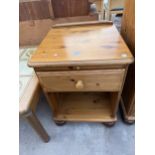 A PINE BEDSIDE TABLE WITH SLIDE