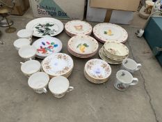 AN ASSORTMENT OF CERAMICS TO INCLUDE CUPS AND PLATES ETC