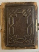 A NEARLY FULL VICTORIAN LEATHER PHOTO ALBUM WITH GOLD LEAF PAGES AND CLASP