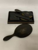 A DARK WOOD DRESSING TABLE SET WITH A HAND MIRROR (A/F), HAIRBRUSH AND CLOTHES BRUSHES WITH A